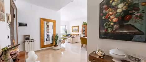 Apartment, 3 Bedrooms, City View | Living area | 50-inch Smart TV with digital channels