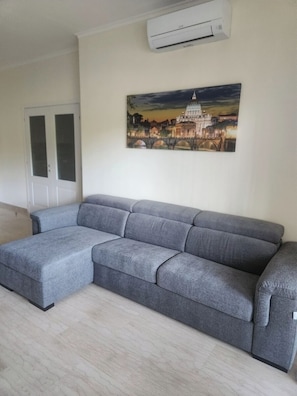 Apartment, 3 Bedrooms, City View | Living area | 50-inch Smart TV with digital channels
