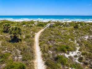 A coastal path leading to the beach. - Oceanfront Home w/ Pool + Private Beach Access (St. Augustine)