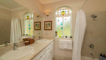 Shower, hair dryer, towels, shampoo
