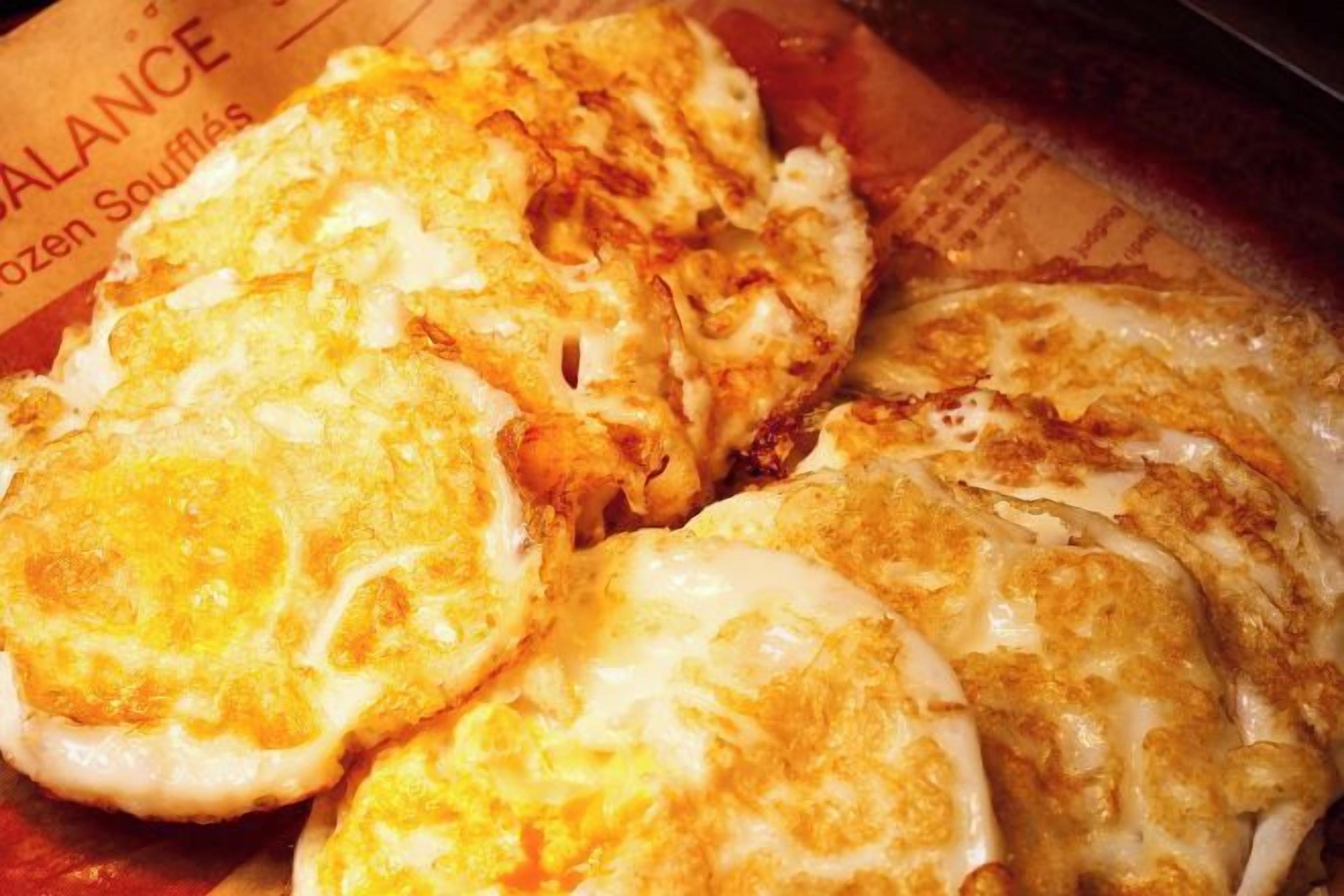 A close-up of a food item, possibly a breakfast dish, with a focus on its texture and appearance.