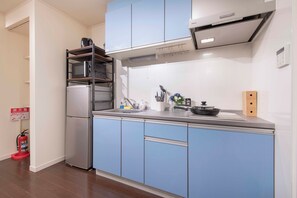 Superior Apartment | Private kitchen | Fridge, microwave, stovetop, cookware/dishes/utensils - Asakusa The Apartment (Tokyo)