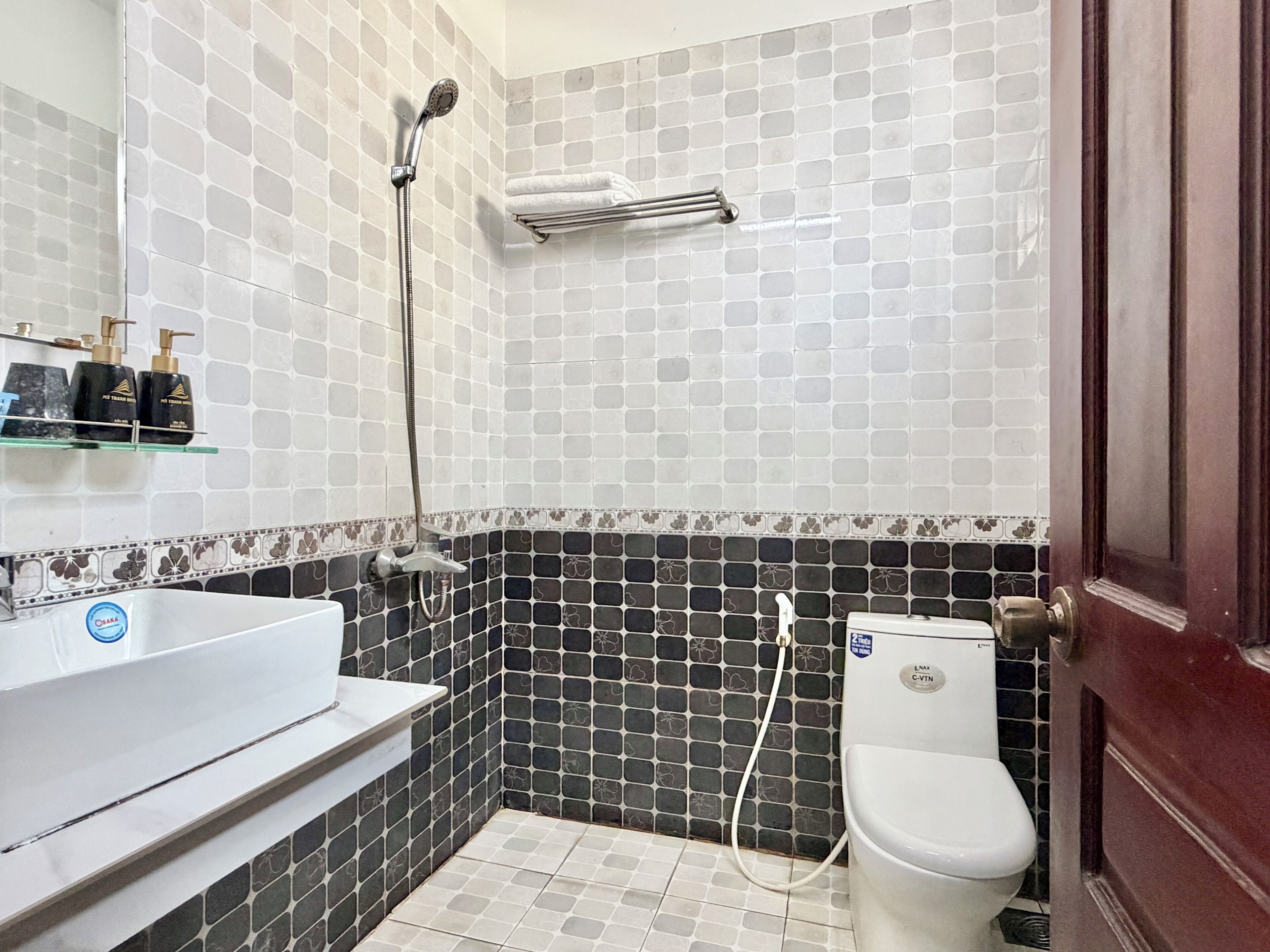 A bathroom with a bathtub, toilet, and shower.