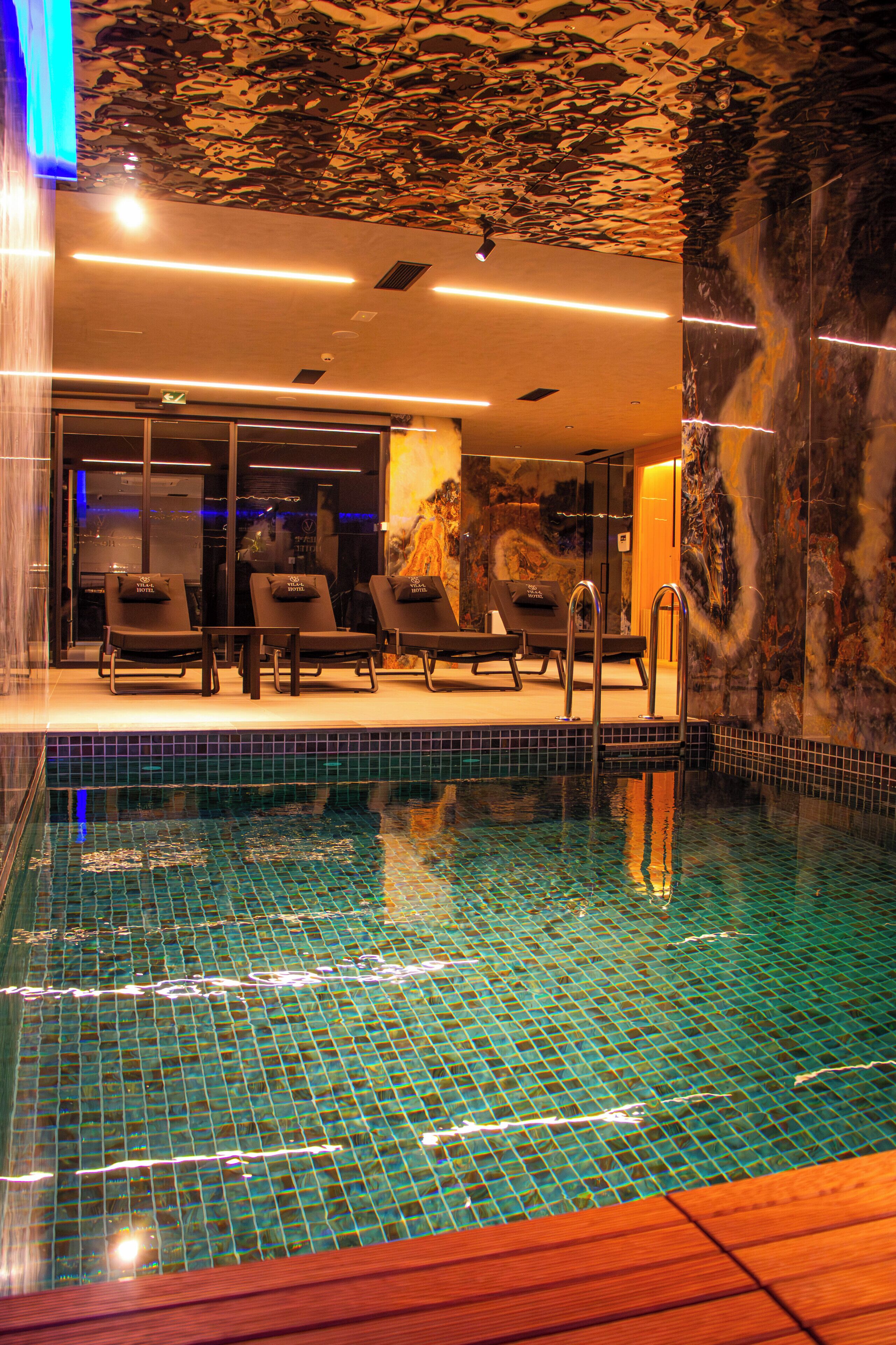 Indoor pool, open 11:00 AM to 10:00 PM, pool loungers