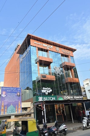 A modern building with a glass facade and a sign reading 'BILTON.'