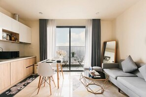 A modern apartment with a kitchen, dining area, and living room. - Mei Housing - Vinhomes D'Capitale Residence Hanoi Central (Hanoi)