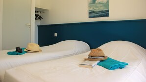 Apartemen | Ruang kerja ramah laptop, tempat tidur bayi gratis, dan seprai linen
