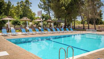 Seasonal outdoor pool, open 8:00 AM to 8:00 PM, pool umbrellas