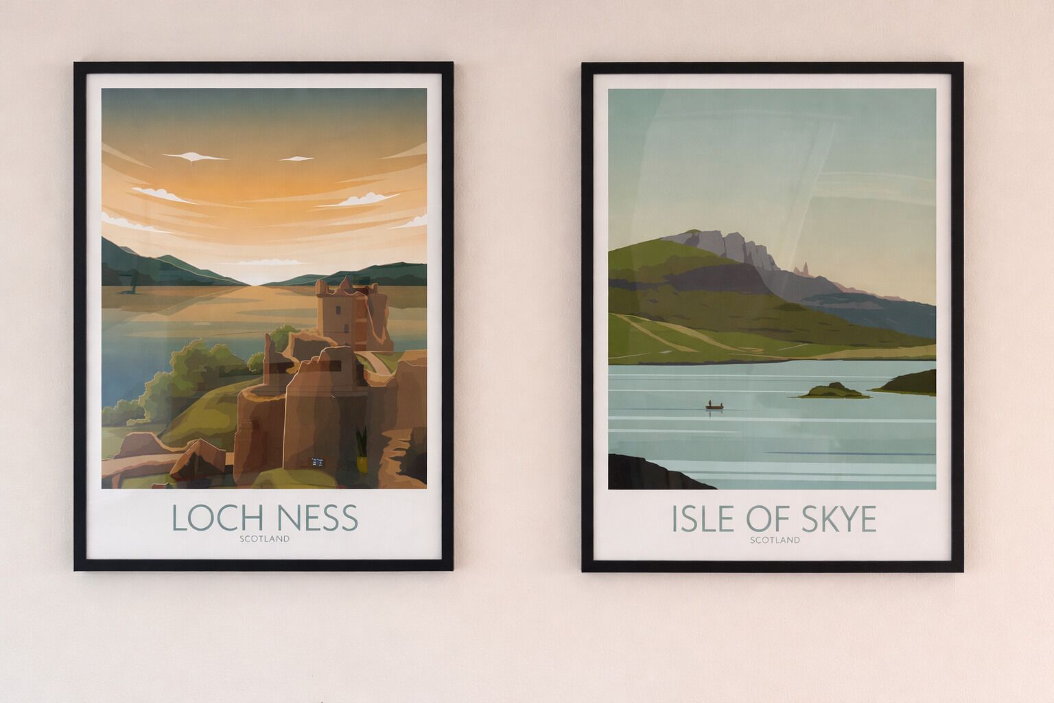 Two framed posters of Loch Ness and Isle of Skye landscapes.