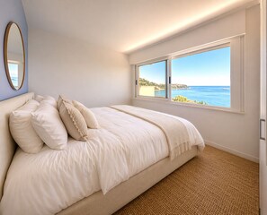 A bedroom with a large bed, a view of the sea, and a mirror on the wall. - Monaco Grand Prix F1, Sea View, Pool, Private Box, Calm, sand beach, transport (Roquebrune-Cap-Martin)