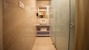 A modern bathroom with a glass shower enclosure, a white sink, and a wooden ceiling. - Four Farm - Best Resort In Nainital For Family (Nainital)