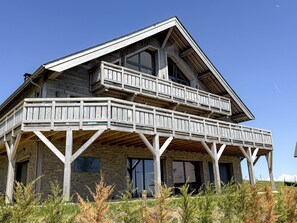 A two-story building with a balcony, wooden beams, and a sign that reads 'L'IMPÉRIALE'. - Chalet panoramic view - 14 guests (Besse-et-Saint-Anastaise-Super Besse)