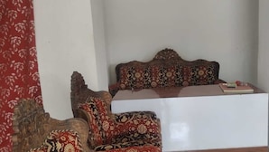 A room with a bed, a desk, and a chair. - Hotel & Bothgaya Waterpark  (Gaya)