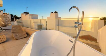 Beautifully refurbished upper townhouse, one of two independent homes in Alvor Old Town. Steps from the waterfront, restaurants and beach, with 2 bedrooms, AC throughout, and access to sunny terraces, Jacuzzi Bath and sea views.