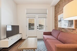 Superior Apartment, Balcony, City View | Living area - Meramont Hotel Centre Ville (Montréal)