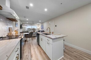 Fridge, microwave, oven, stovetop - Brand New Oceanfront 2BR/2BA- Hot Tub, Heated Pool, EV Charger, 2 Parking spots (Carolina Beach)
