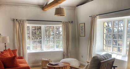 Cosy straw bale cottage at the Arusha Giraffe Centre Sanctuary.