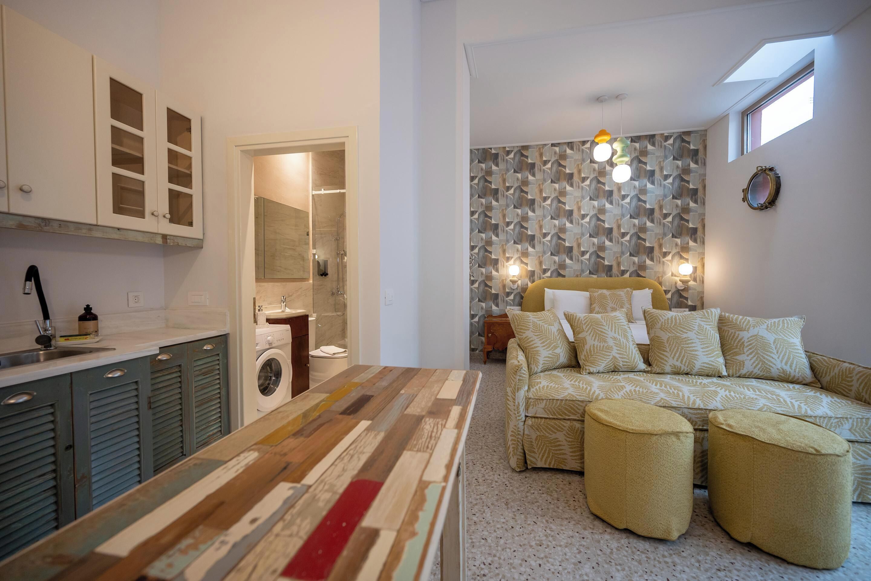 Family Studio with Private Yard | Living area | 34-inch flat-screen TV with cable channels