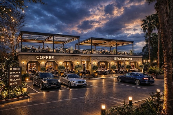 A two-story building with a coffee shop and restaurant on the ground floor, featuring outdoor seating and a covered area.