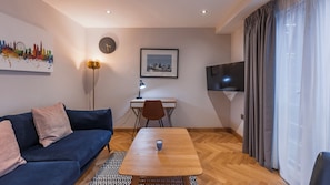 Deluxe appartement | Woonruimte | Flatscreentelevisie