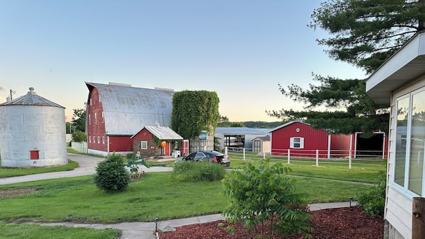 A rural property with a barn, silo, and a small house. - Experience a Farm getaway! (Bagley)