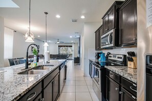 Fridge, microwave, oven, stovetop - Nemo's Coral Cove Luxury Disney Villa w/ Pool (Kissimmee)
