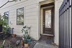 A house with a front door, a number '1905' on the wall, and potted plants outside. - Pool, Hot Tub, 3 bedrooms 3 bathrooms walkable cute neighborhood near downtown. (Houston)