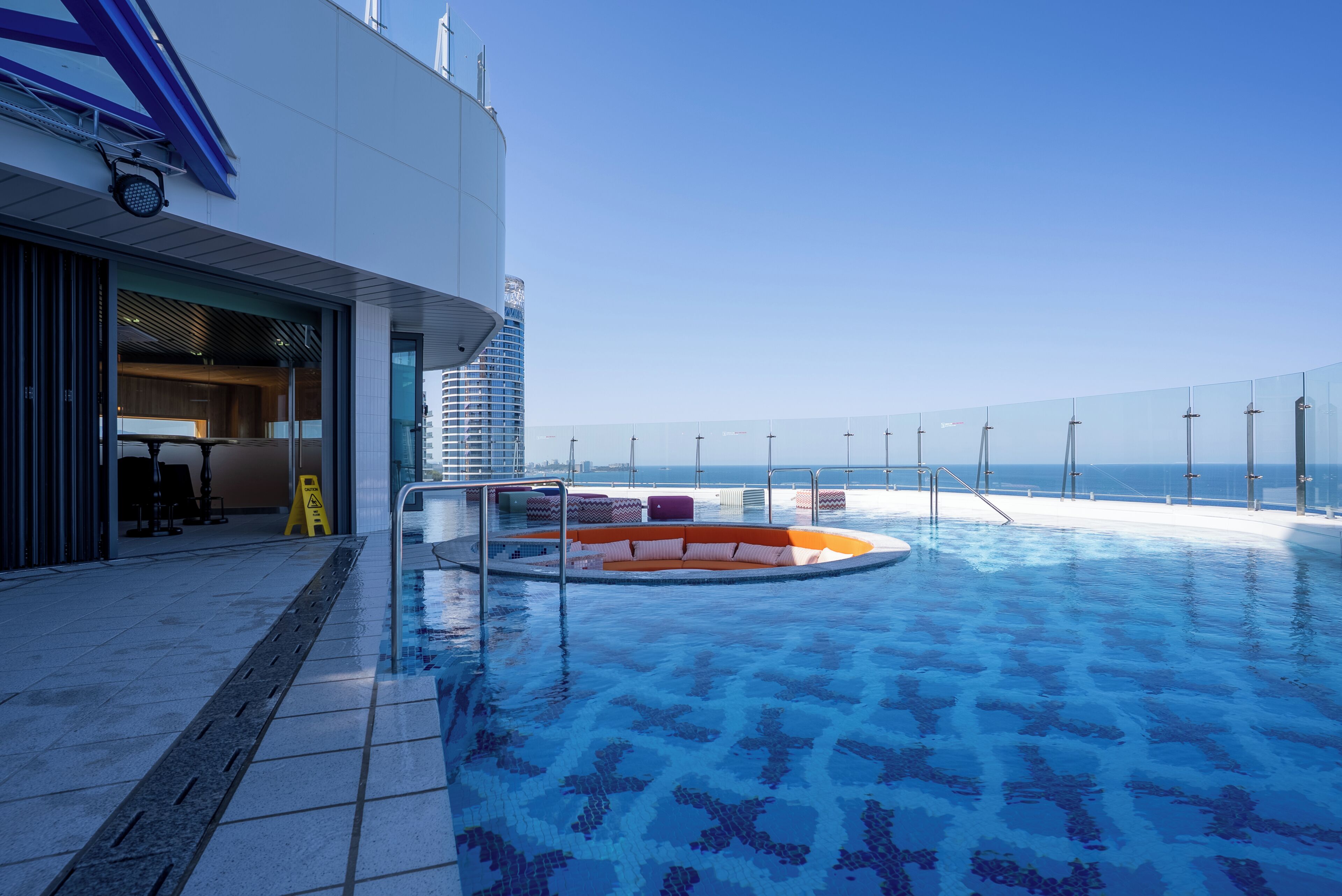 Outdoor pool, open 2:00 PM to 10:00 PM, pool loungers