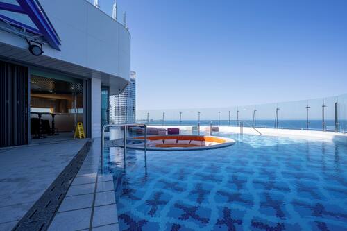 Outdoor pool, open 2:00 PM to 10:00 PM, pool loungers