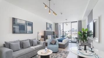 Luxury Studio, Balcony, City View | Living area | 55-inch Smart TV with cable channels