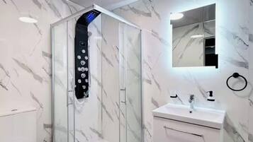 Shower, hair dryer, towels, soap