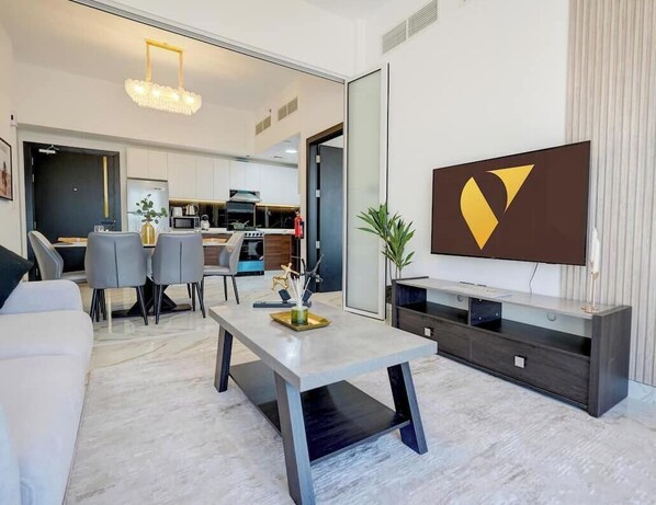 Luxury Apartment, Balcony, City View | Living area | 65-inch Smart TV with cable channels - Vogue | Olivz Residence by Danube Near Dragon Mart (Dubai)