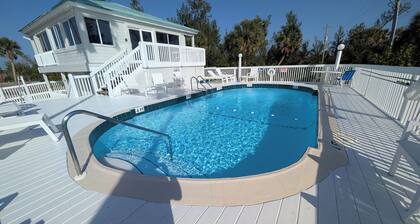Your private beach retreat awaits! Heated pool, free ferry & parking!