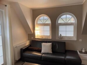 Living area - Cozy retreat with fireplace, sunny balcony & stylish comfort (Zingst)