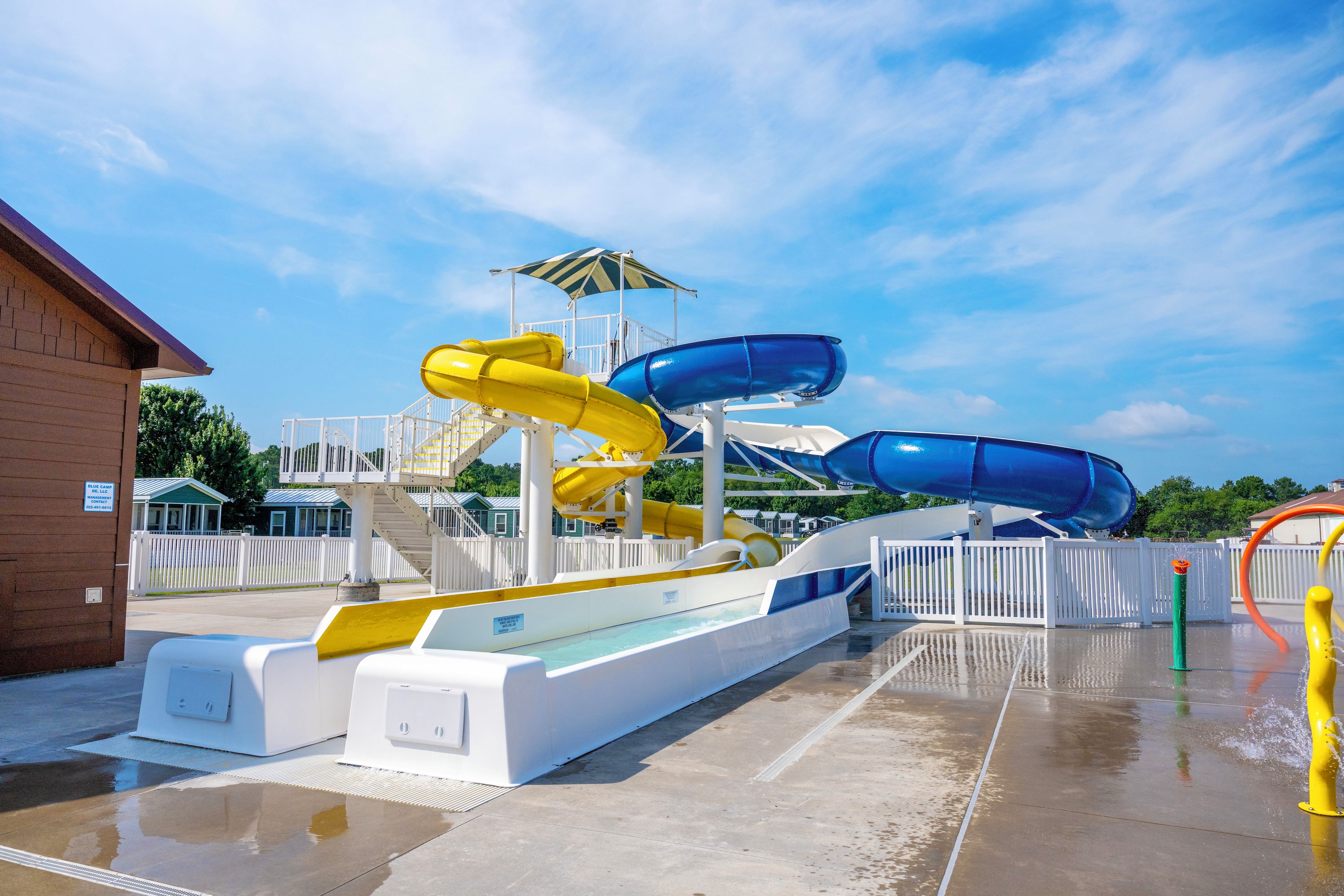 A water park with multiple slides and a covered area.