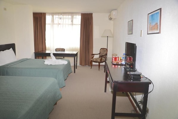 Quarto quádruplo standard, vista para a cidade