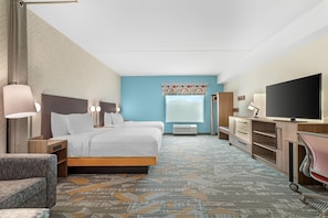 A hotel room with two beds, a desk, a television, and a window with a view. - Home2 Suites By Hilton Powell Knoxville North (Knoxville)