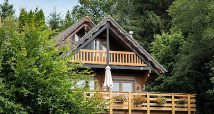 This spacious two-story wooden Finnish chalet accommodates up to 6 people across three comfortable bedrooms, making it perfect for larger families or holidays with friends.
