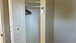 A closed door with a white frame, a white wall, and a tiled floor. - Comfortable 1-bedroom apartment close to Beach with AC- Vero Beach (Vero Beach)