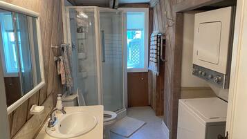 Shower, towels, soap, toilet paper