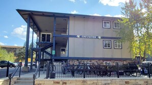 A building with a sign reading 'Edelweiss' and a bike parking area in front. - BEST LOCATION! Cozy condo on Main Street. Walk to gondola. (Breckenridge)
