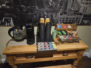 A coffee station with a Keurig machine, cups, and a tray of coffee pods. - K-Town OC Stay / Foodie Paradise Near Disneyland (Buena Park)