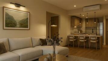 Quarto luxo, vista para o jardim | Área de estar