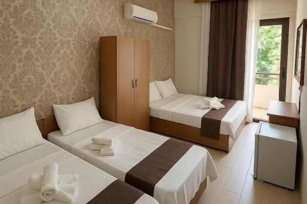 Quadruple Room, Balcony, City View | Desk