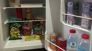 A refrigerator stocked with snacks, beverages, and dairy products. - HOTEL PANORAMA ÖZDERE (Menderes)