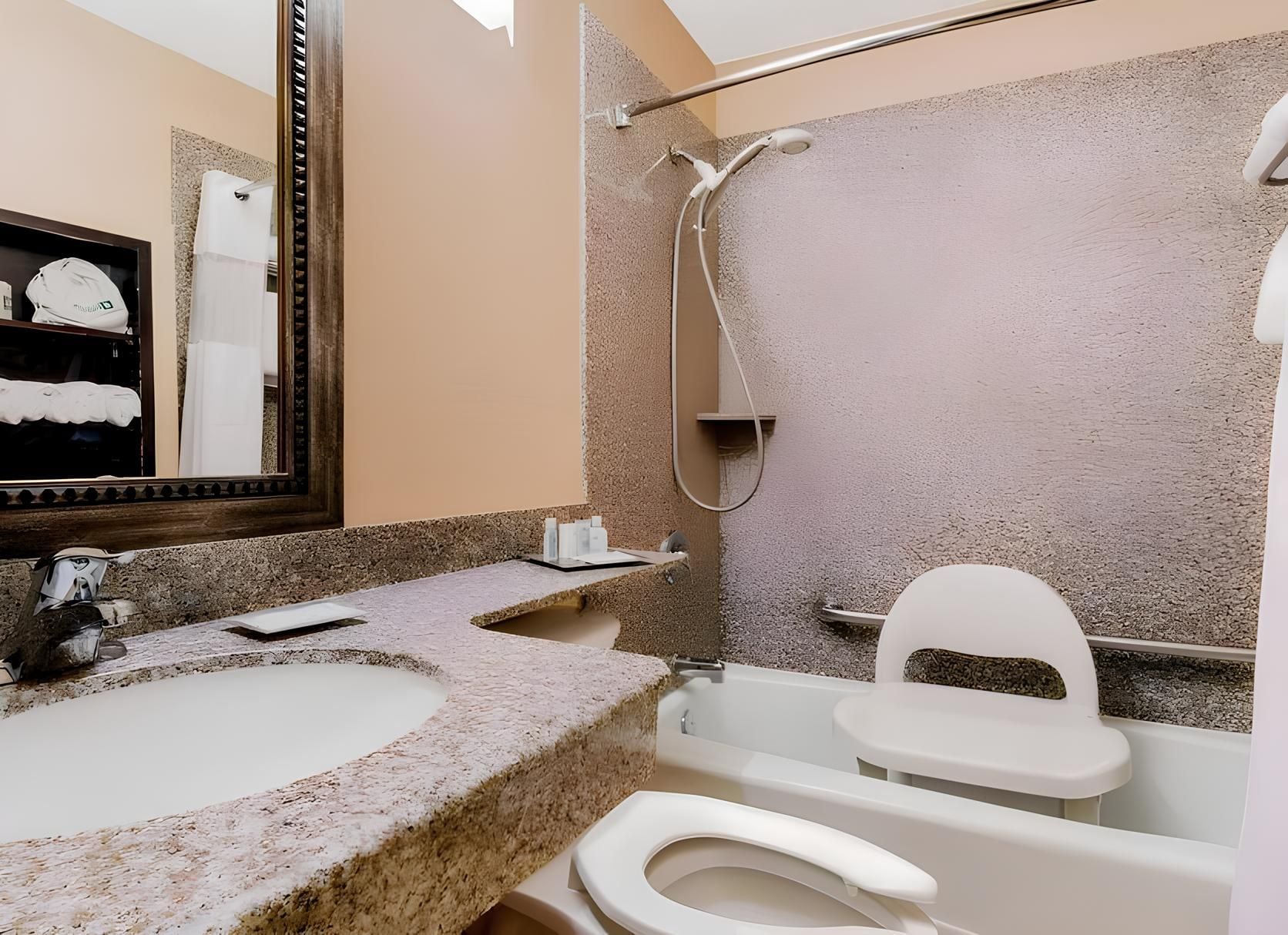 A bathroom with a sink, toilet, and bathtub.