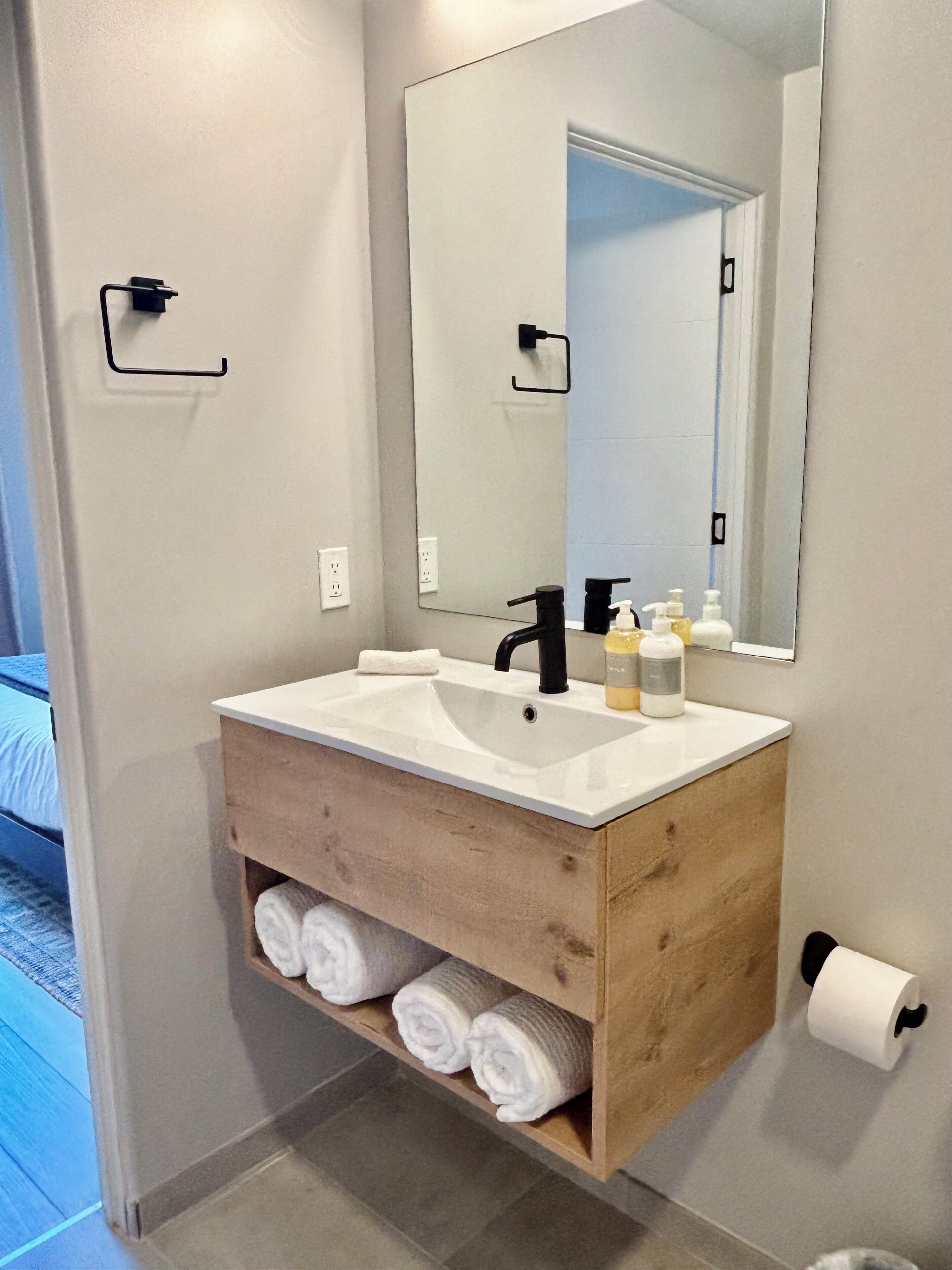 Hair dryer, towels, soap, toilet paper