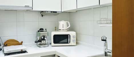 Fridge, microwave, stovetop, coffee/tea maker