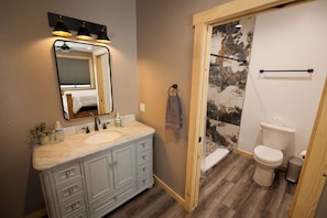 Shower, towels, soap, toilet paper