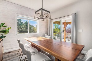 Dining - 5 Bedroom house with amenities galore! Oversized hot tub, outdoor fire pit, smoker and propane grill, sauna, play set, espresso machine, air hockey table, indoor fireplace in both living rooms, and legacy bar. (Colorado Springs)